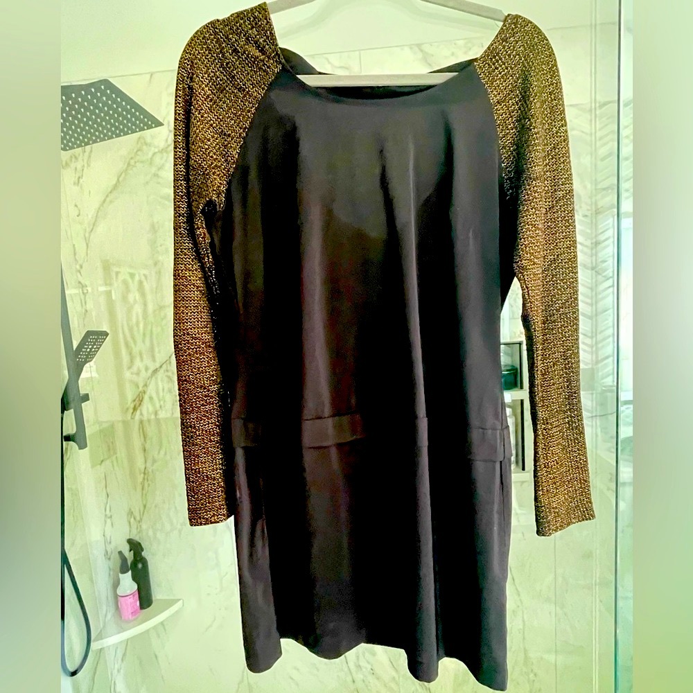 Small bcbg mini dress . Blk n gold